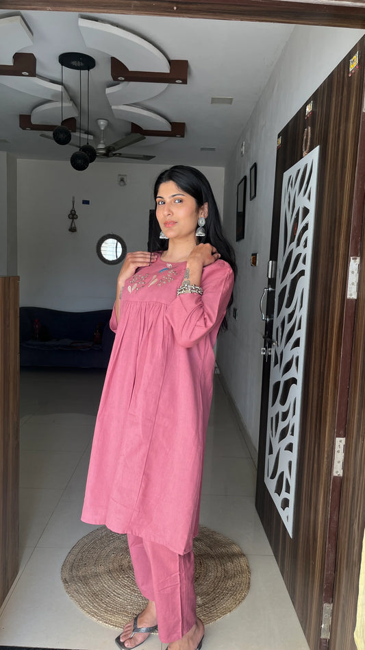 Model wearing Urrva's Dusty Rose Charm Co-ord – pink embroidered cotton kurta set