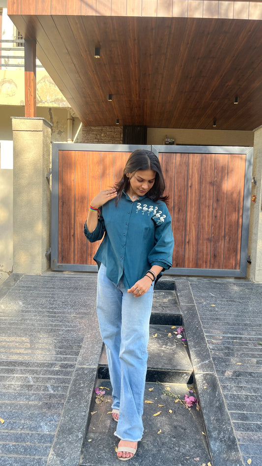 Model in teal Flamingo Line Shirt with quirky flamingo embroidery by Urrva