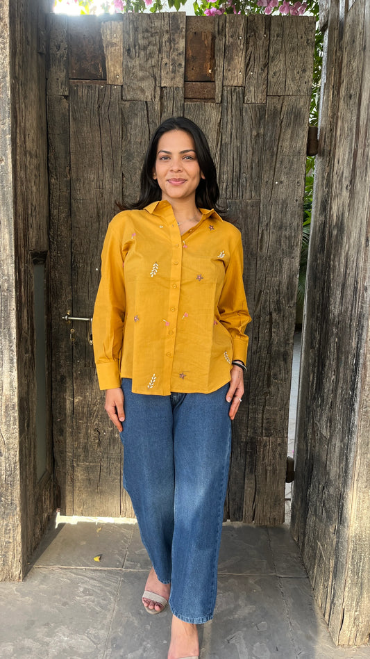 Model in mustard yellow Golden Bloom Shirt with floral embroidery by Urrva