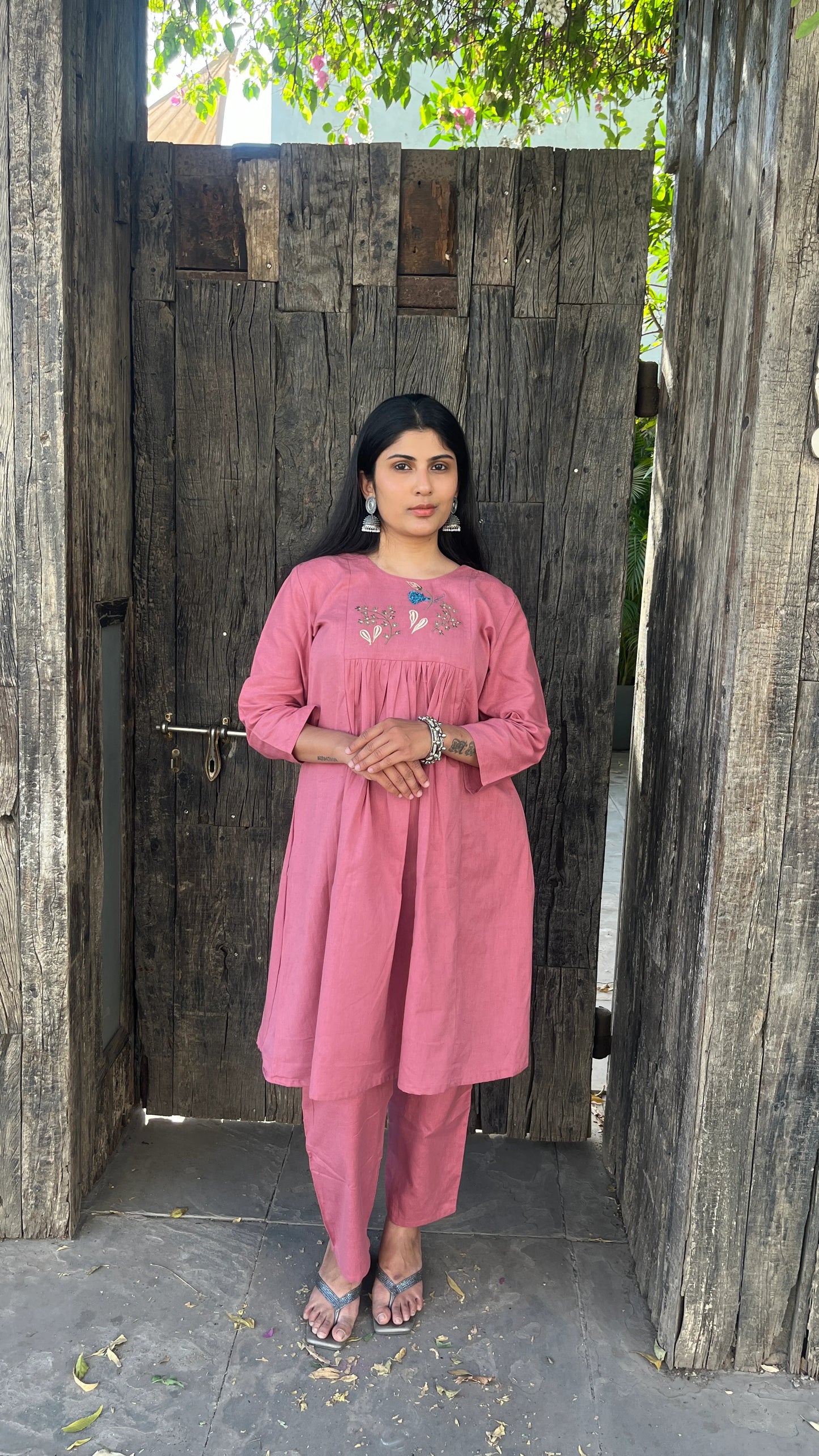 Model wearing Urrva's Dusty Rose Charm Co-ord – pink embroidered cotton kurta set