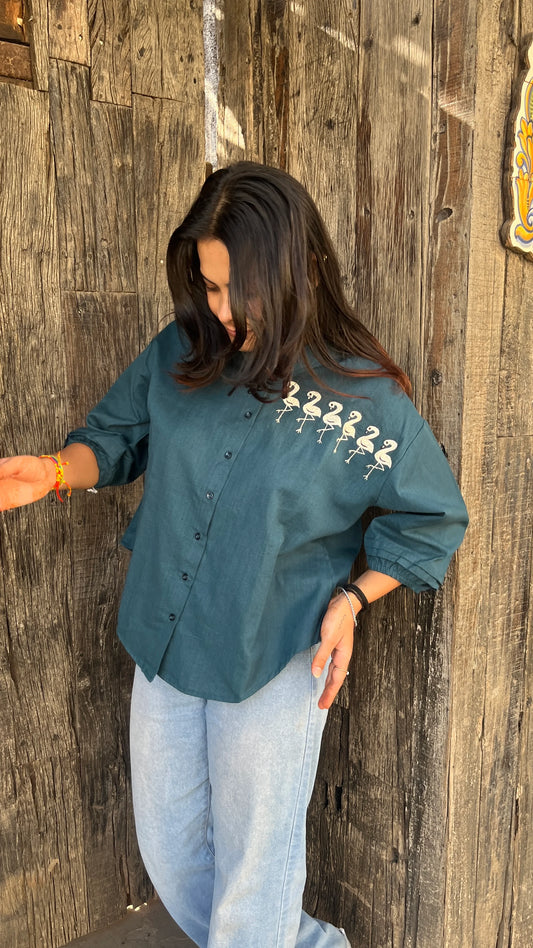 Model in teal Flamingo Line Shirt with quirky flamingo embroidery by Urrva
