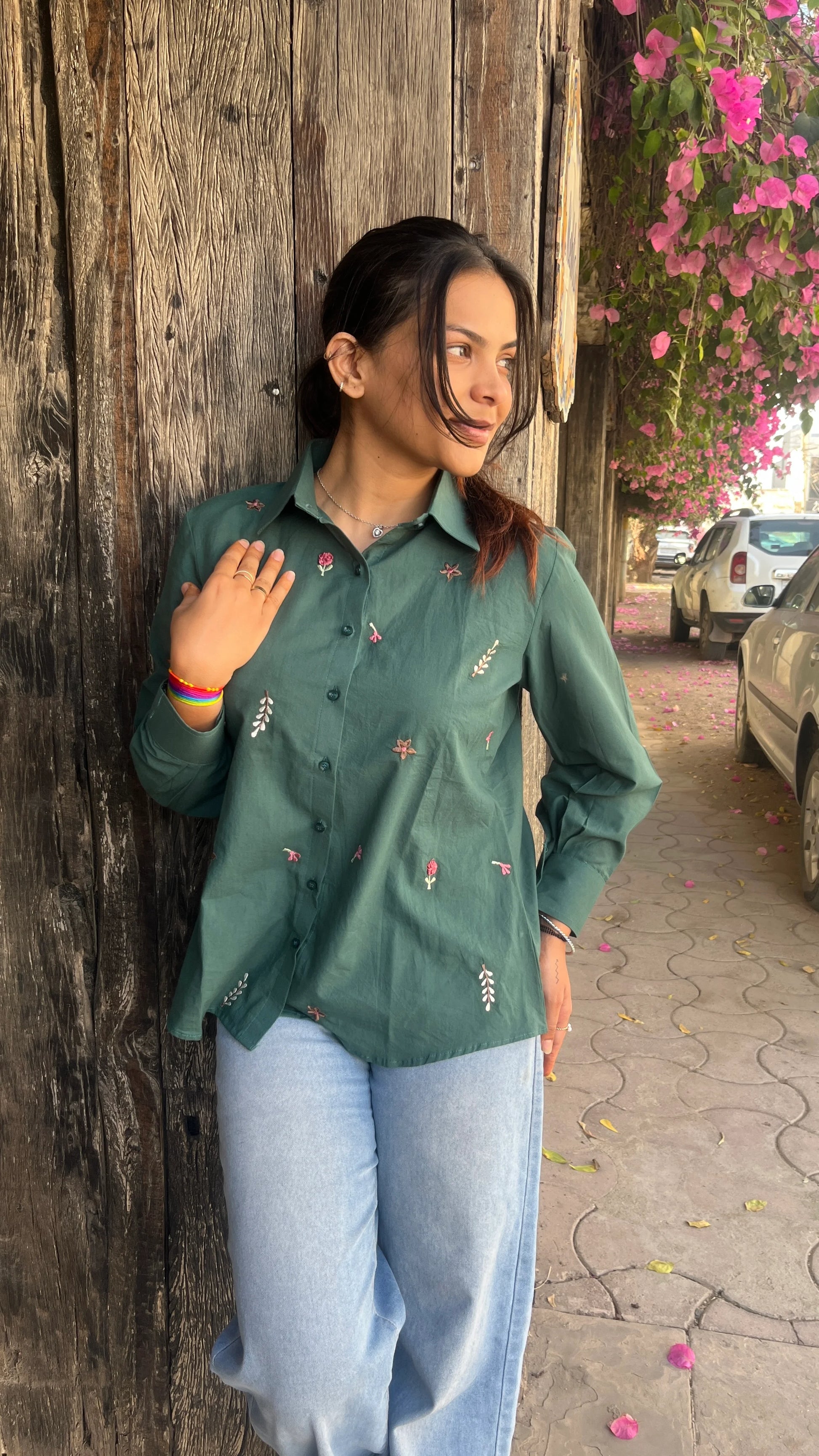 Model wearing forest green Green Meadow Shirt with floral embroidery by Urrva