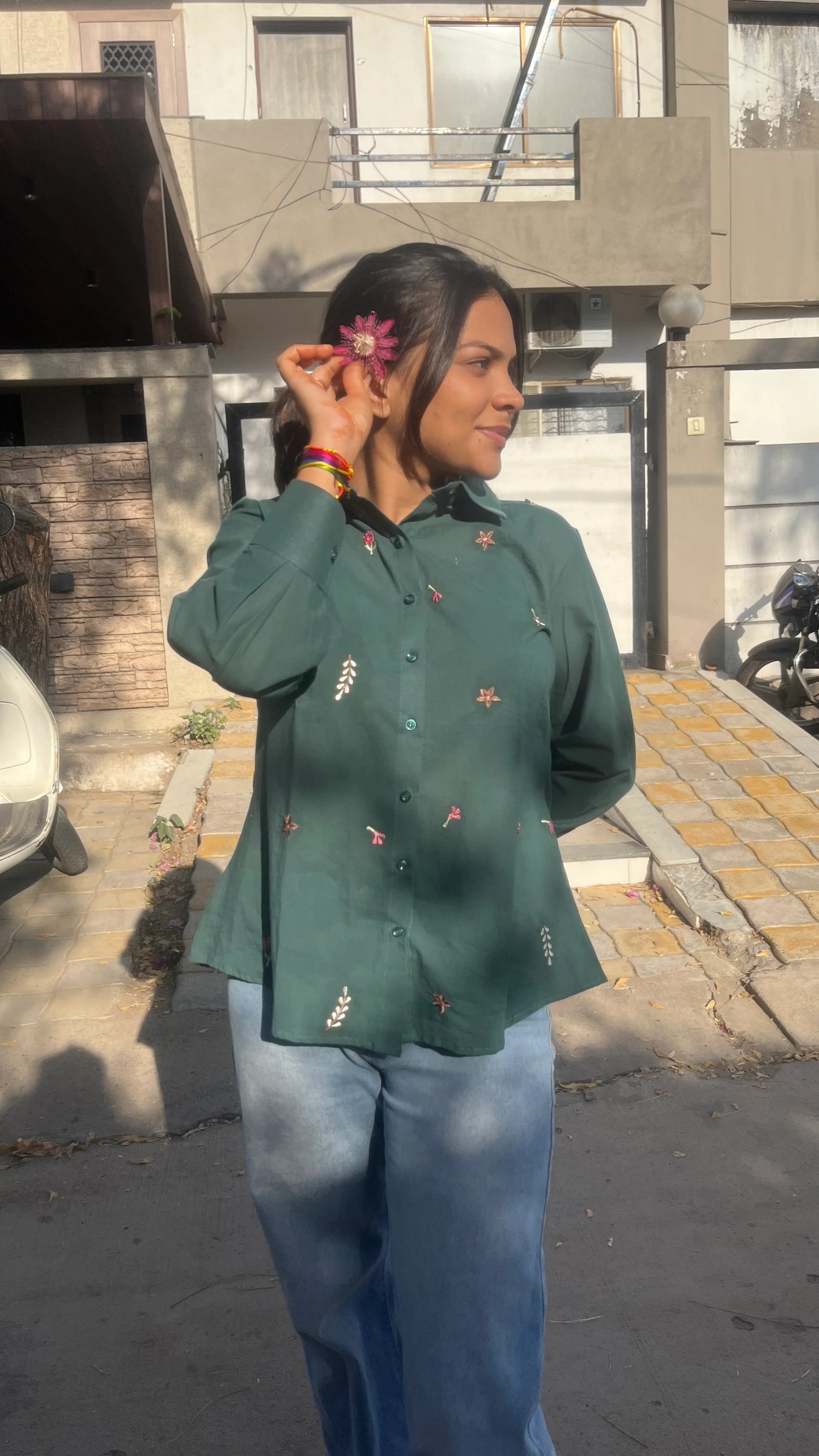 Model wearing forest green Green Meadow Shirt with floral embroidery by Urrva