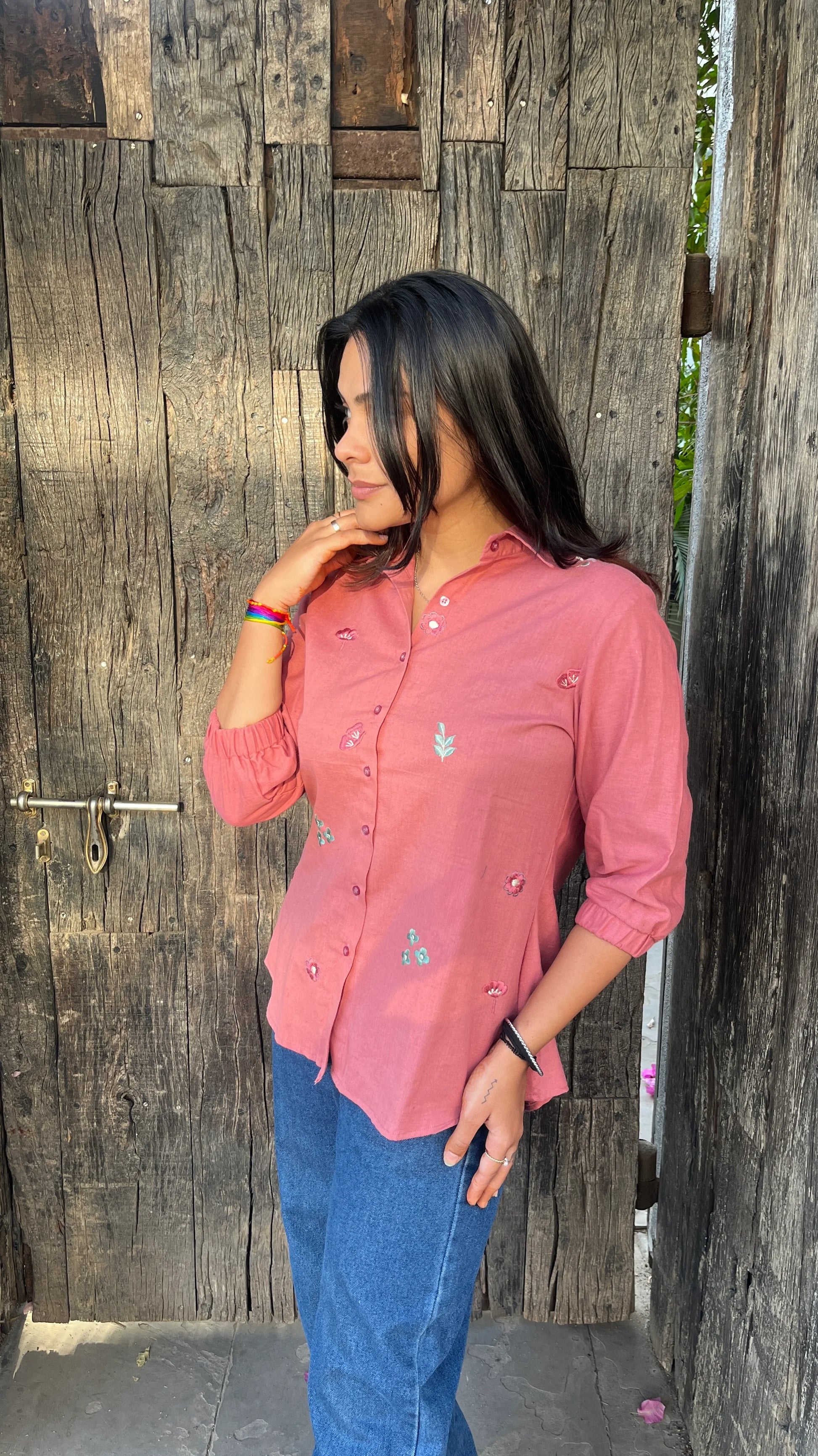 Model wearing Rosé Bloom Shirt in pink cotton with floral embroidery by Urrva