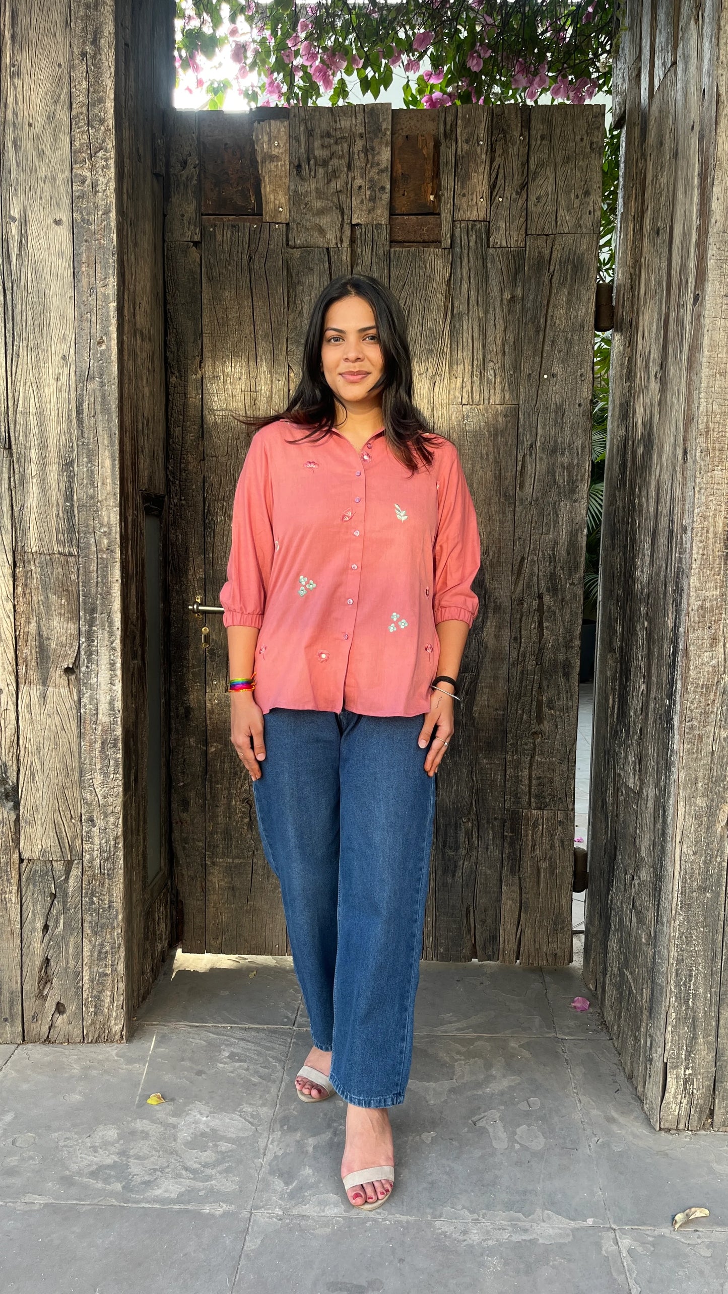 Model wearing Rosé Bloom Shirt in pink cotton with floral embroidery by Urrva