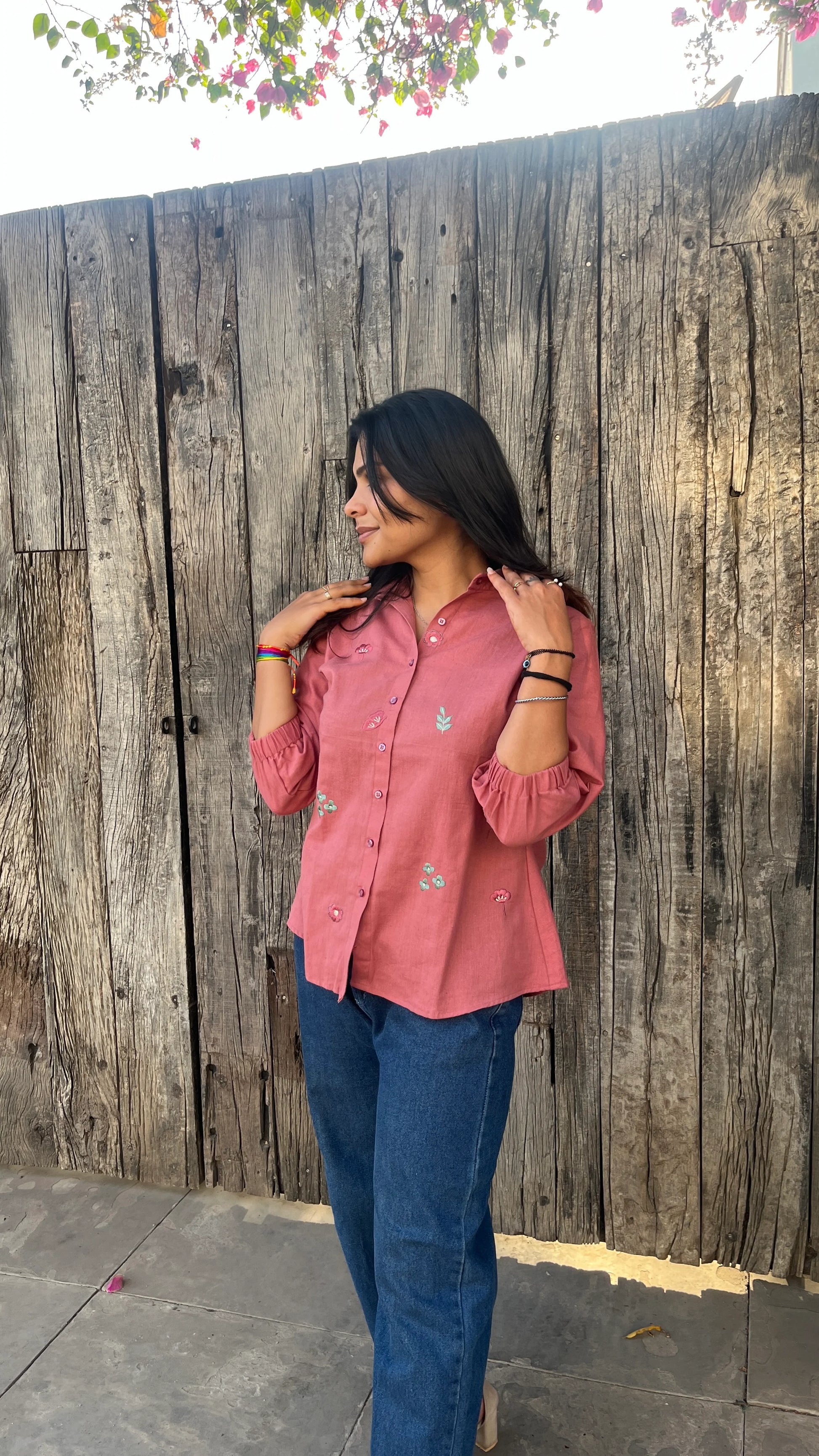 Model wearing Rosé Bloom Shirt in pink cotton with floral embroidery by Urrva