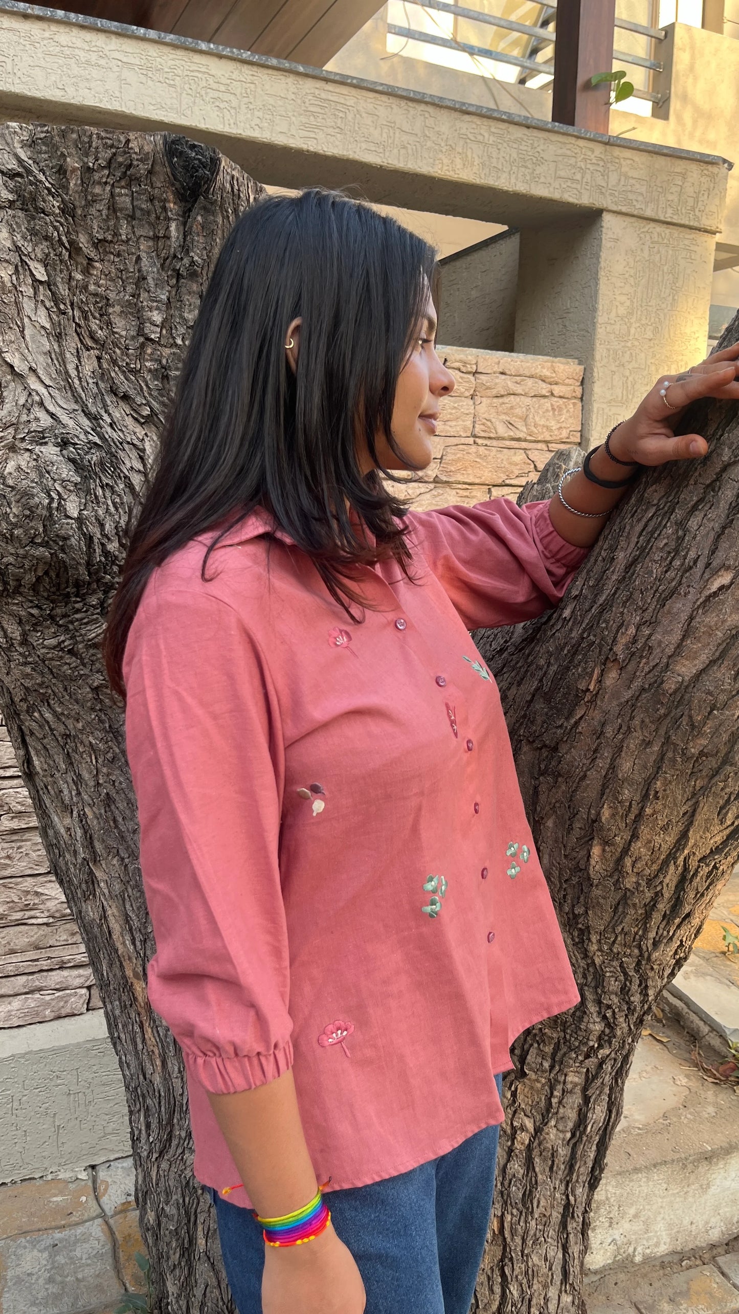 Model wearing Rosé Bloom Shirt in pink cotton with floral embroidery by Urrva