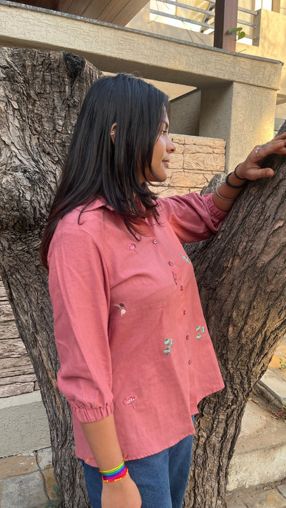 Model wearing Rosé Bloom Shirt in pink cotton with floral embroidery by Urrva