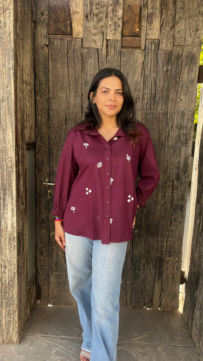 Model wearing wine bloom linen shirt with floral embroidery by Urrva