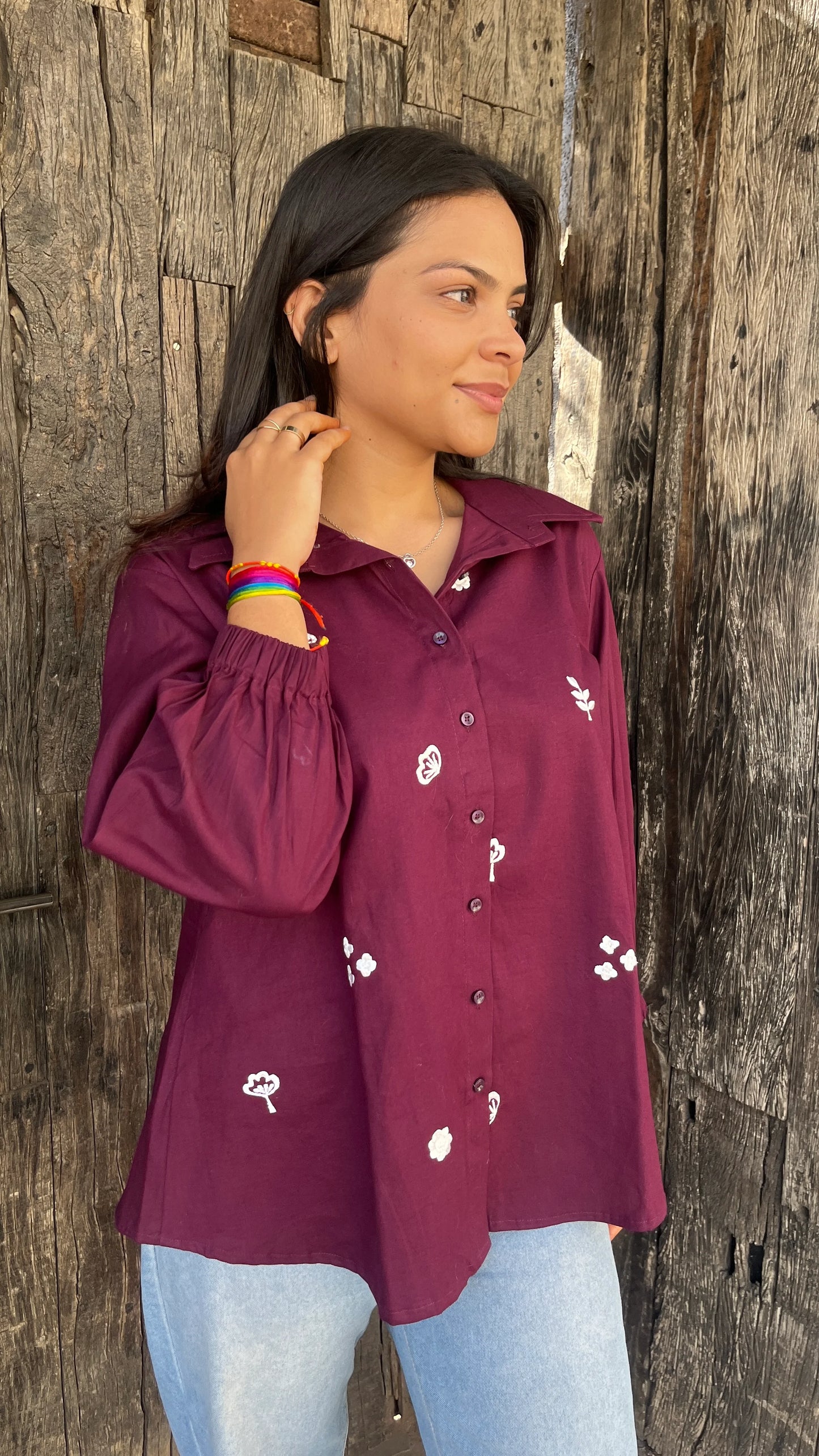 Model wearing wine bloom linen shirt with floral embroidery by Urrva