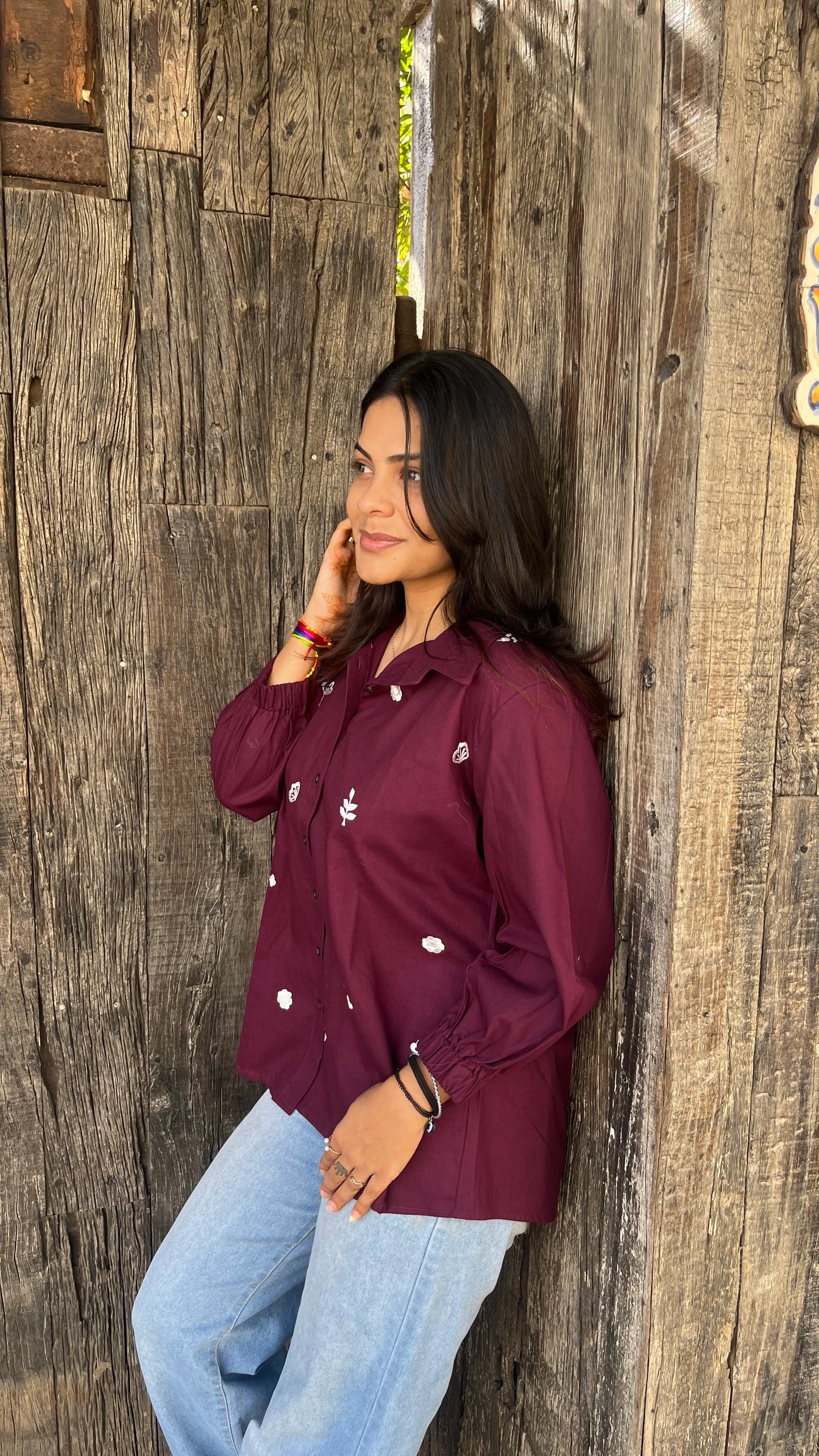 Model wearing wine bloom linen shirt with floral embroidery by Urrva