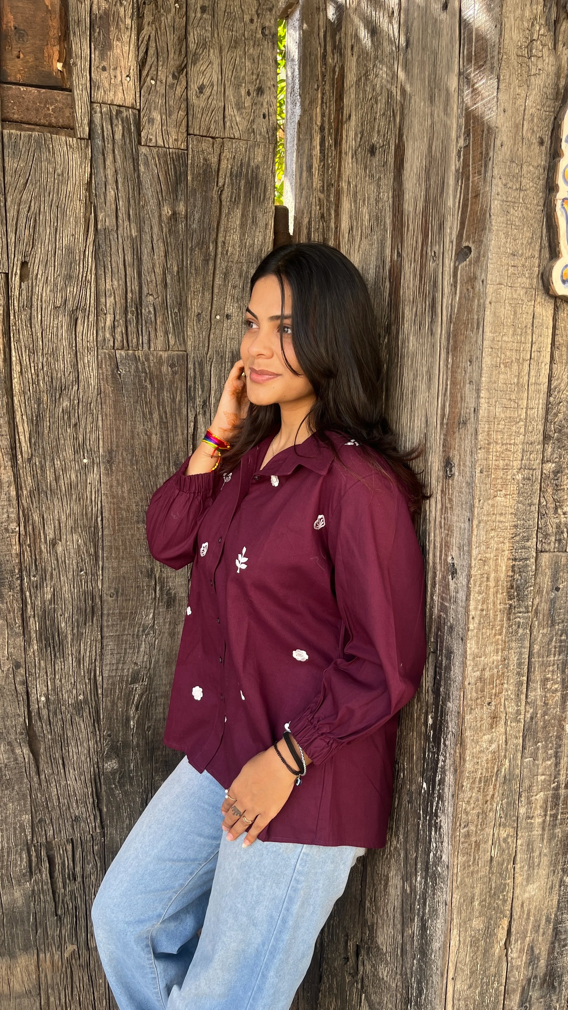 Model wearing wine bloom linen shirt with floral embroidery by Urrva