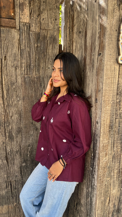 Model wearing wine bloom linen shirt with floral embroidery by Urrva